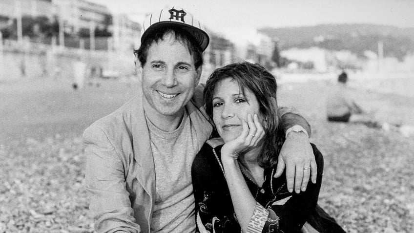 A photo of Paul Simon and Carrie Fisher