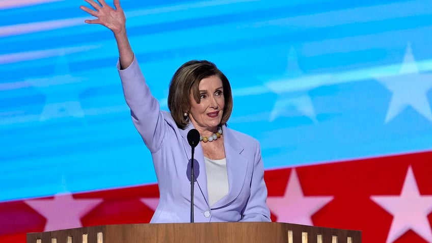 Pelosi waves to DNC attendees