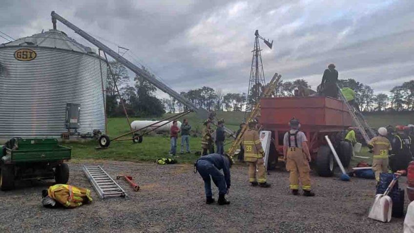 pennsylvania boy buried up to his head in corn rescued from grain bin fire officials say