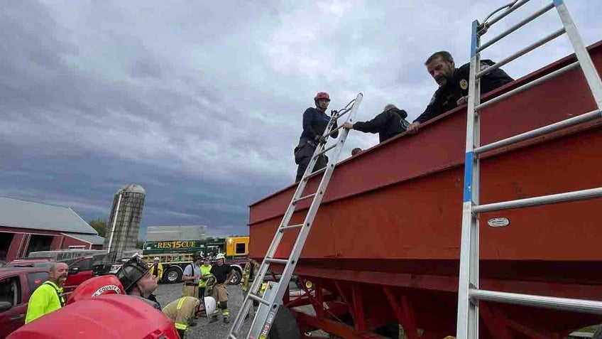 pennsylvania boy buried up to his head in corn rescued from grain bin fire officials say