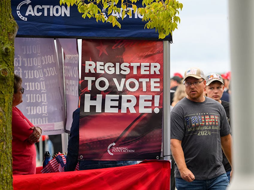 A sign highlights efforts to sign up voters at the Bayfront Convention Center before Repub