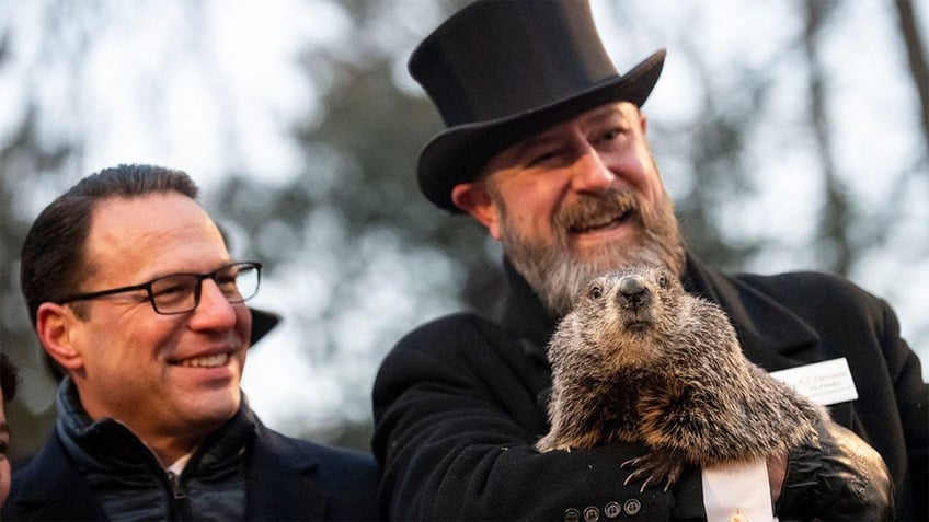 Pennsylvania Gov. Josh Shapiro, left, appears with Punxsutawney Phil. (Getty Images)