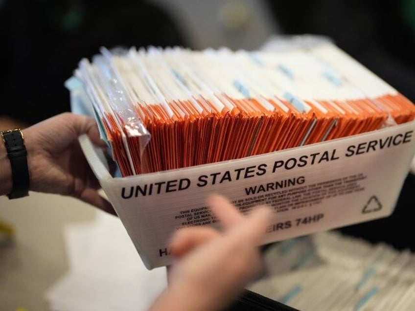 Mail-in ballots for the 2024 General Election in the United States are seen at a Voter Ser