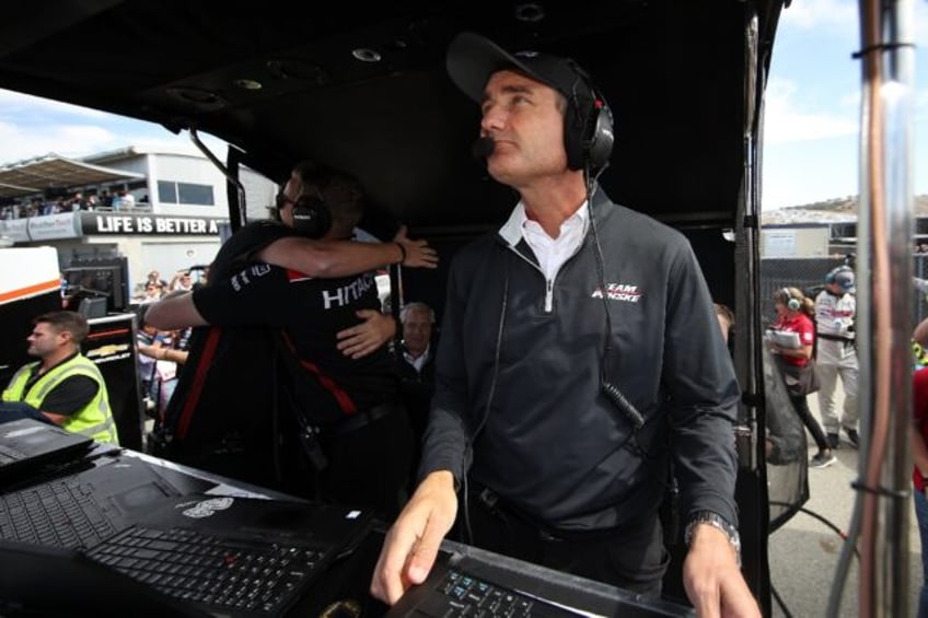 Penske Racing team president Tim Cindric and three others were suspended for two races by