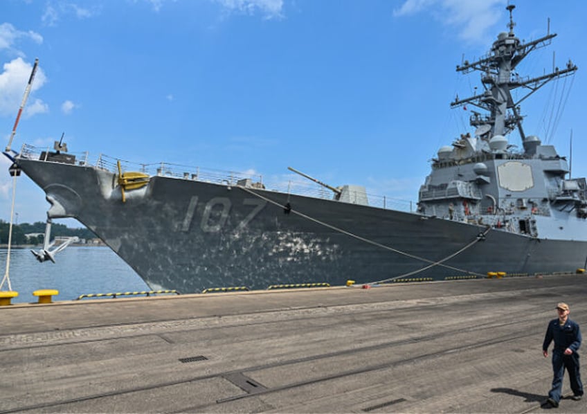 GDYNIA, POLAND - JUNE 07: An US navy soldier walks past the USS Gravely Destroyer Ship moo