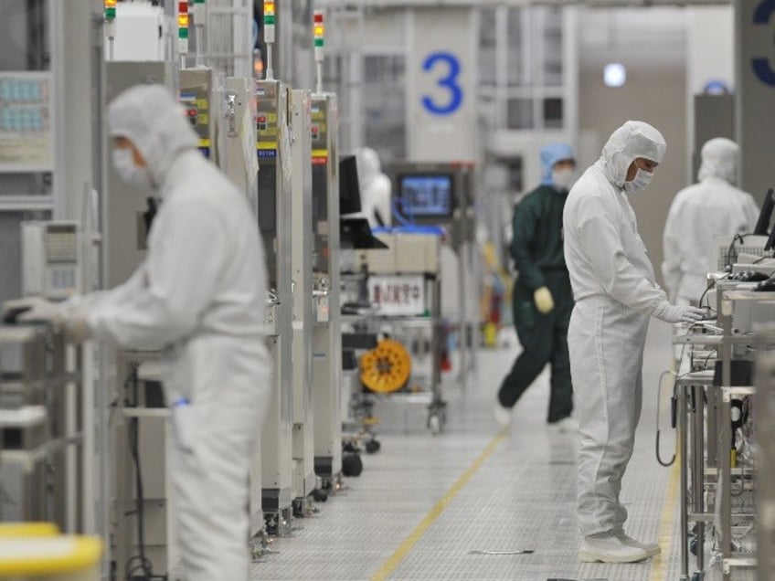 employees working in a microchip factory