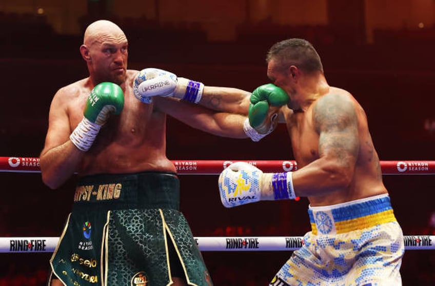 Tyson Fury and Oleksandr Usyk exchange punches during the IBF, WBA, WBC, WBO and Undisputed Heavyweight titles' fight between Tyson Fury and...