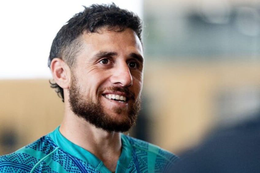 Hurricanes scrum-half TJ Perenara speaks to media