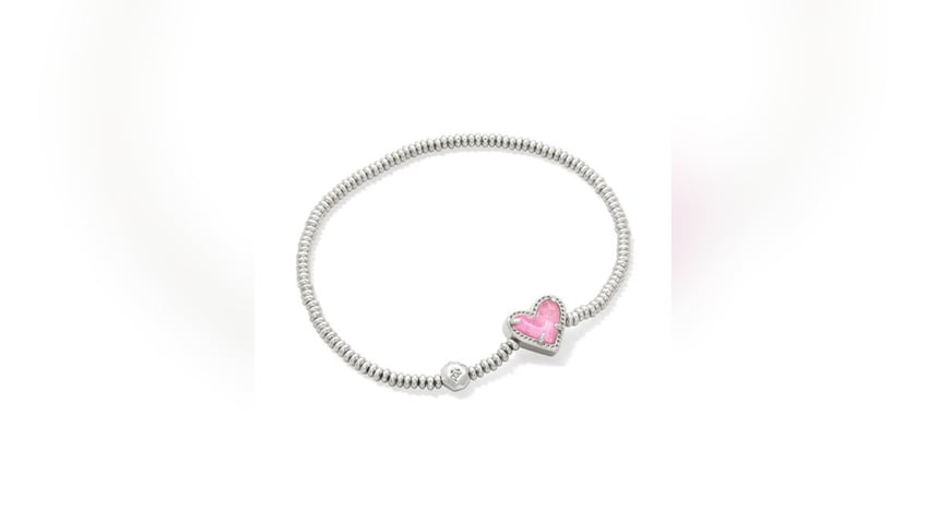 A stylish heart stretch bracelet from Kendra Scott makes a statement.