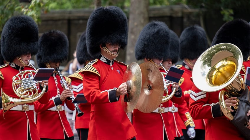 The King's Guard remove their Bearskin hats