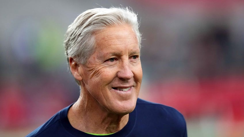 Pete Carroll looks on