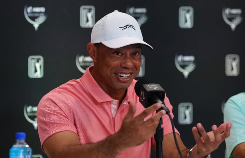 Tiger Woods talks to reporters ahead of the unofficial Hero World Challenge in the Bahamas