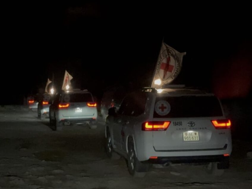 GAZA - FEBRUARY 27: Red Cross vehicles, carrying the bodies of four Israeli hostages, leav