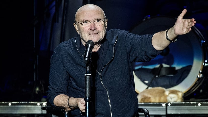 Phil Collins behind microphone