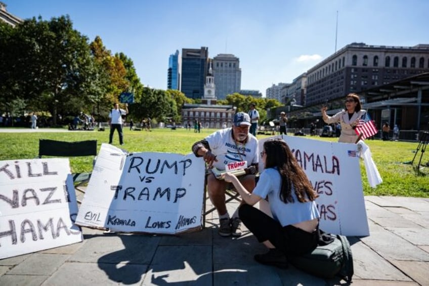 A supporter of former US president and Republican presidential nominee Donald Trump sits o