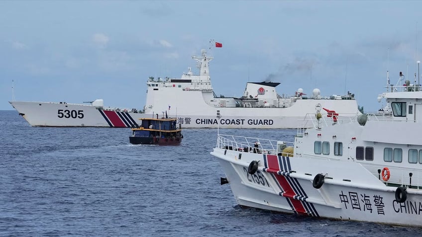 philippine boats breach chinese coast guard blockade near disputed shoal in south china sea