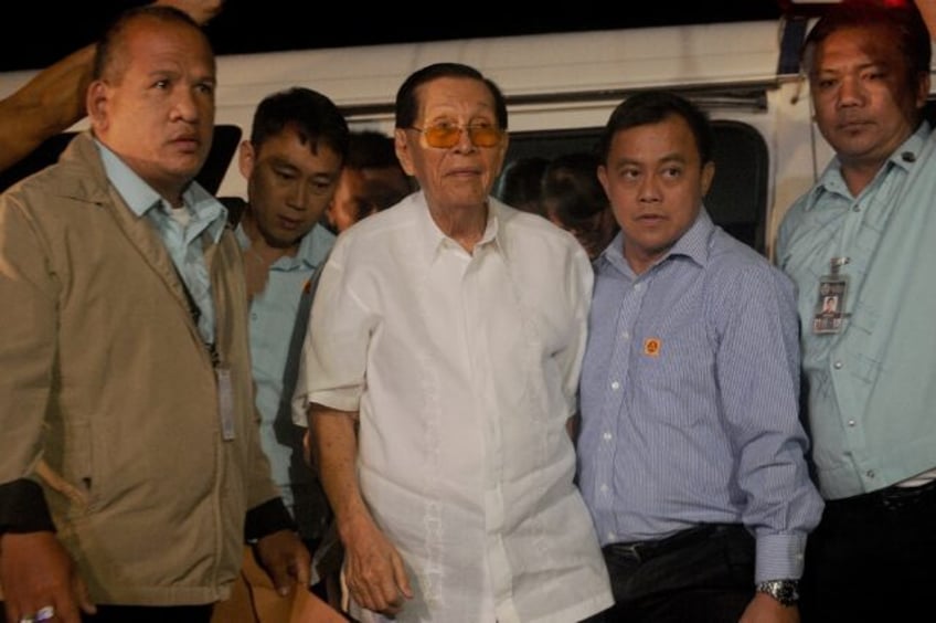 Veteran Philippine politician Juan Ponce Enrile (C), pictured arriving at court in 2015, h