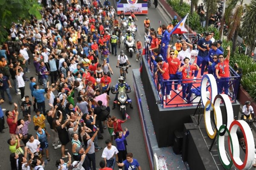 Philippines' Carlos Yulo (C), Paris 2024 Olympic Games double gold medalist in gymnastics,