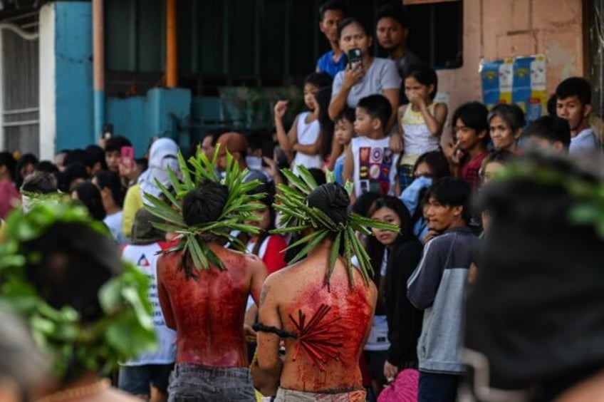 Hundreds gathered in villages around San Fernando city, north of Manila, to watch men puni