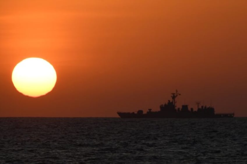 A Chinese navy ship sails near Scarborough Shoal, in disputed waters of the South China Se