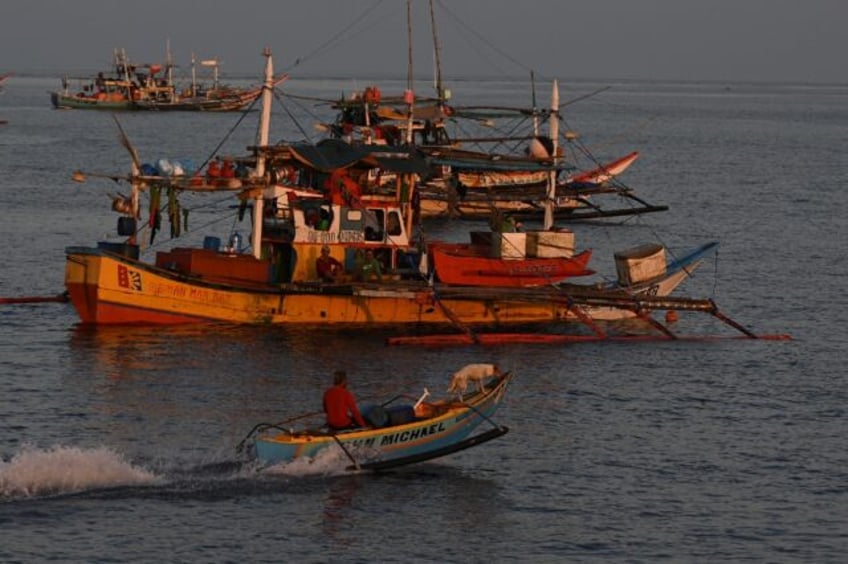 philippines vows removal of chinese barriers at disputed reef