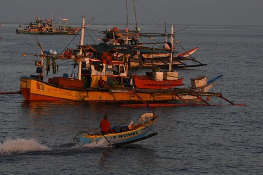 philippines vows removal of chinese barriers at disputed reef