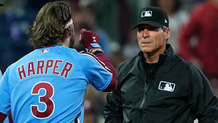 phillies bryce harper throws batting helmet into stands after ejection