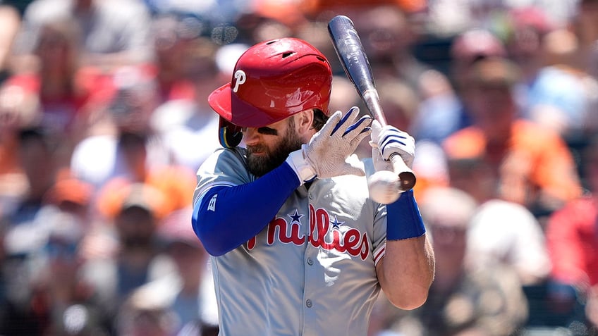 Bryce Harper backs away from a pitch