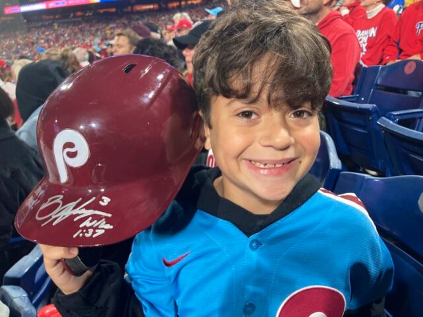 phillies harper flips out on ump tosses helmet into the stands where its retrieved by 10 year old