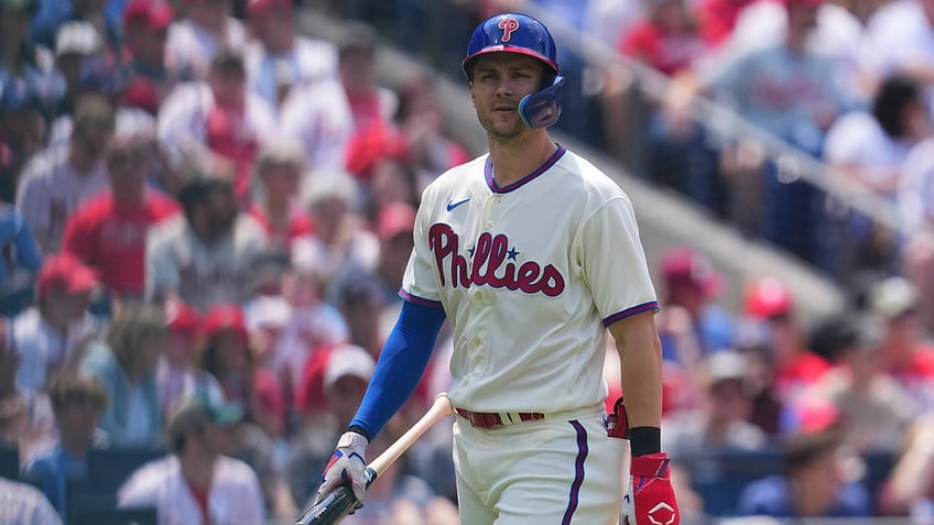 Trea Turner looks on during a game