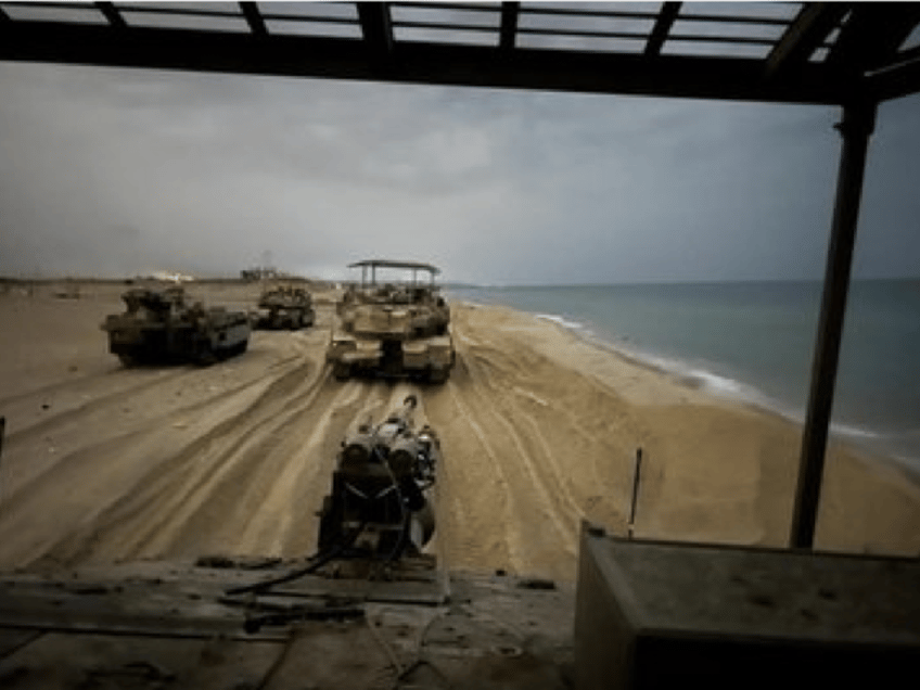 photo israeli armored vehicles on the beach in gaza