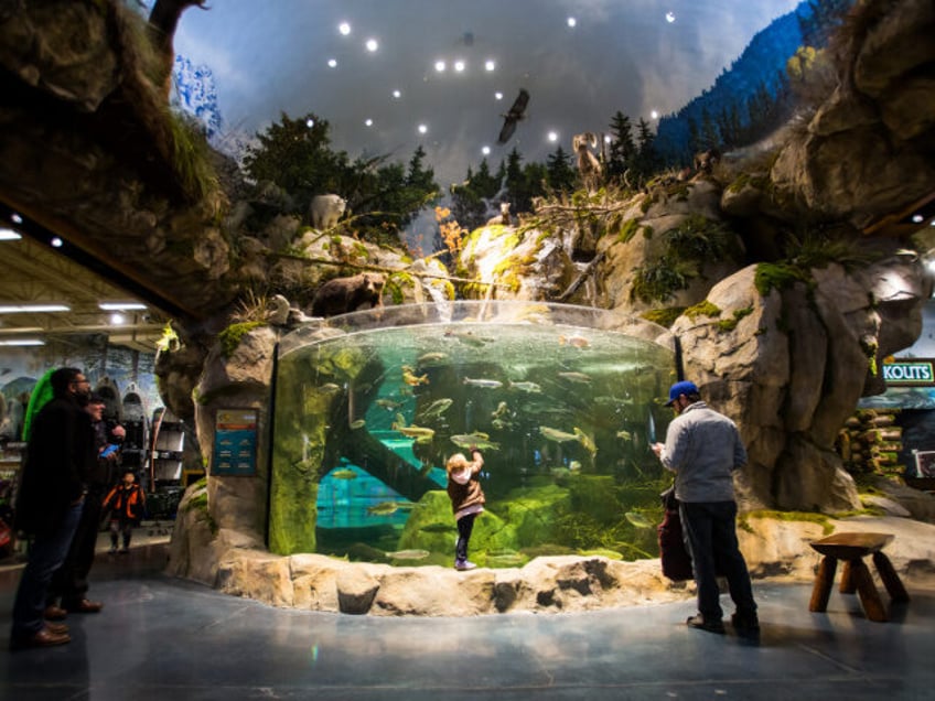 Shoppers view the aquarium display at Bass Pro Shops inside the Tsawwassen Mills mall in Tsawwassen, British Columbia, Canada, on Wednesday, Feb. 8, 2017. The day Tsawwassen Mills opened last October in suburban Vancouver, shoppers lined up before dawn to get a first shot at Canada's biggest new mall in …