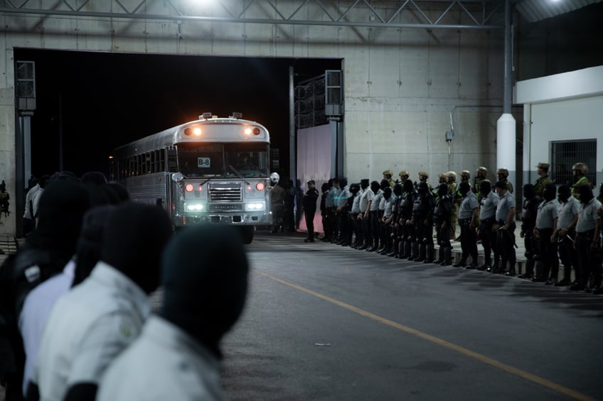 photos first look at trumps deported gang members arriving at el salvadors mega prison