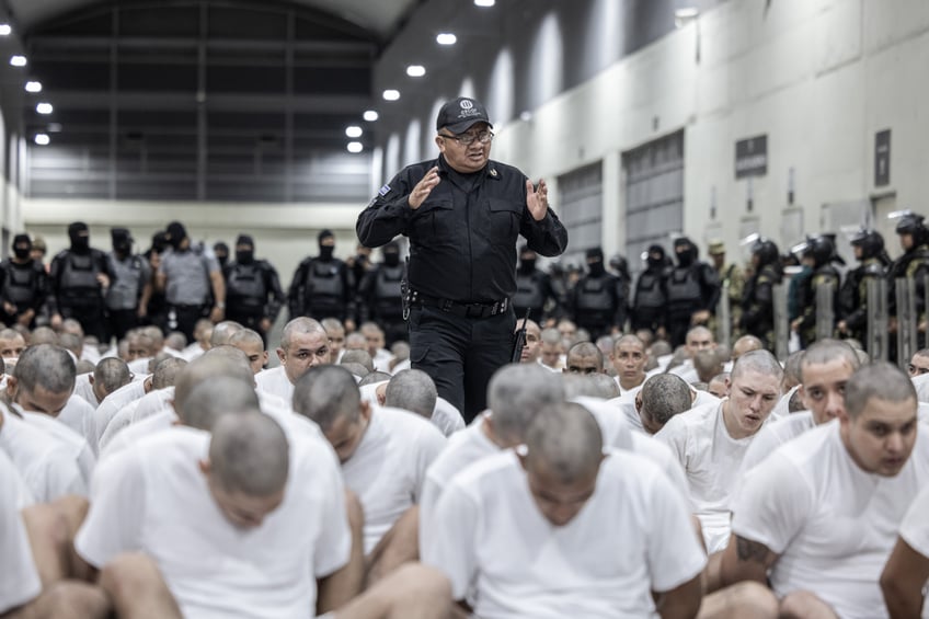 photos first look at trumps deported gang members arriving at el salvadors mega prison