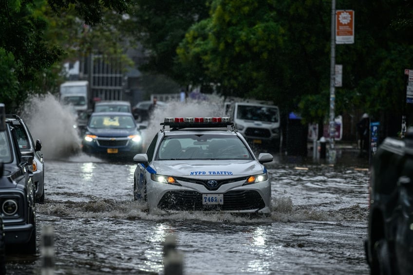 photos heavy rains bring flash floods to new york city roads and subways paralyzed as state of emergency declared