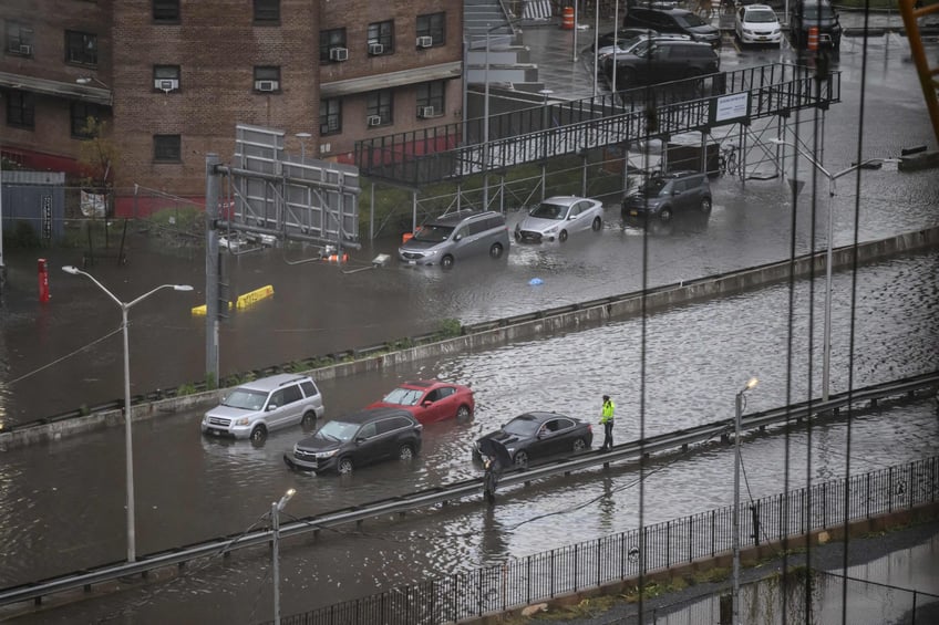 photos heavy rains bring flash floods to new york city roads and subways paralyzed as state of emergency declared