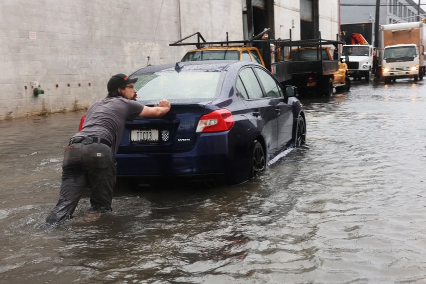 photos heavy rains bring flash floods to new york city roads and subways paralyzed as state of emergency declared