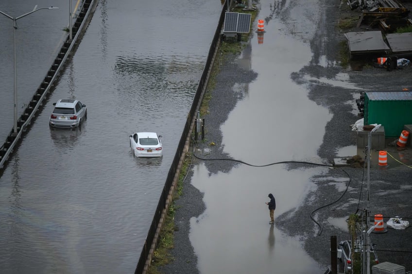 photos heavy rains bring flash floods to new york city roads and subways paralyzed as state of emergency declared