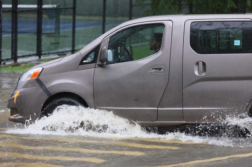 photos heavy rains bring flash floods to new york city roads and subways paralyzed as state of emergency declared