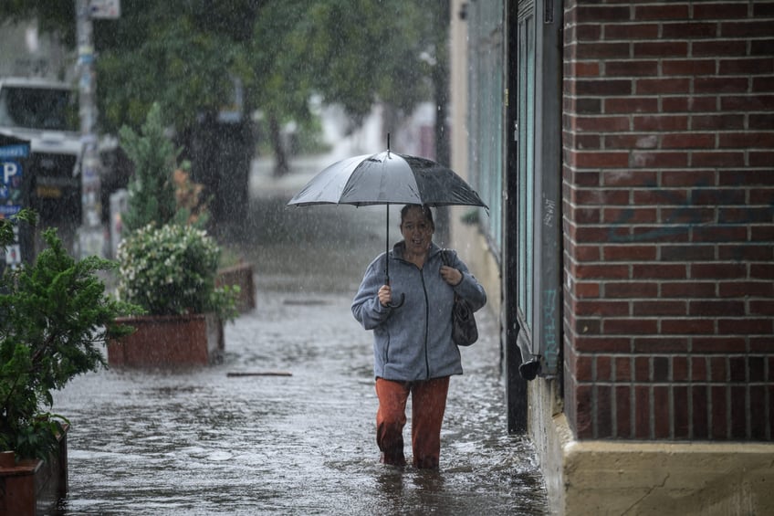 photos heavy rains bring flash floods to new york city roads and subways paralyzed as state of emergency declared