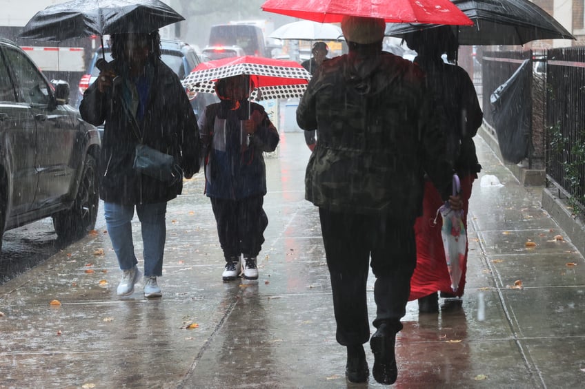 photos heavy rains bring flash floods to new york city roads and subways paralyzed as state of emergency declared