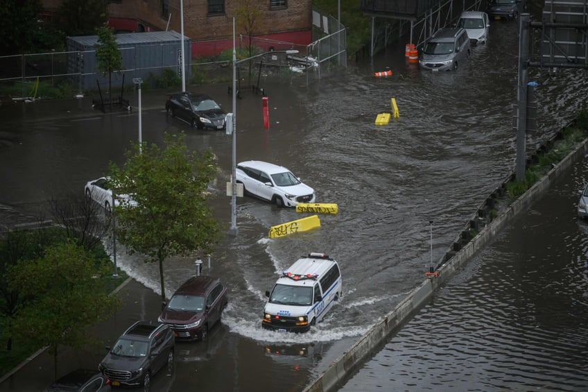 photos heavy rains bring flash floods to new york city roads and subways paralyzed as state of emergency declared