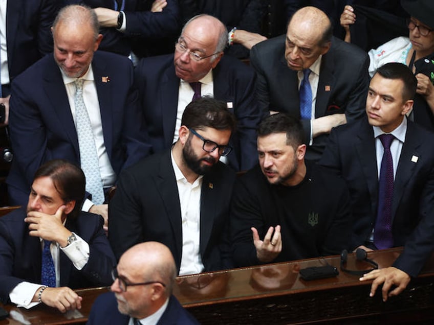 (L-R, first row) Uruguay's President Luis Lacalle, Chile's President Gabriel Boric, Ukraine's President Volodymyr Zelensky and Ecuador's President Daniel Noboa attend the inauguration of Argentina's new president Javier Milei (out of frame) at the Congress in Buenos Aires on December 10, 2023. Libertarian economist Javier Milei was sworn in Sunday as Argentina's president, after a resounding election victory fuelled by fury over the country's economic crisis. (Photo by ALEJANDRO PAGNI / AFP)