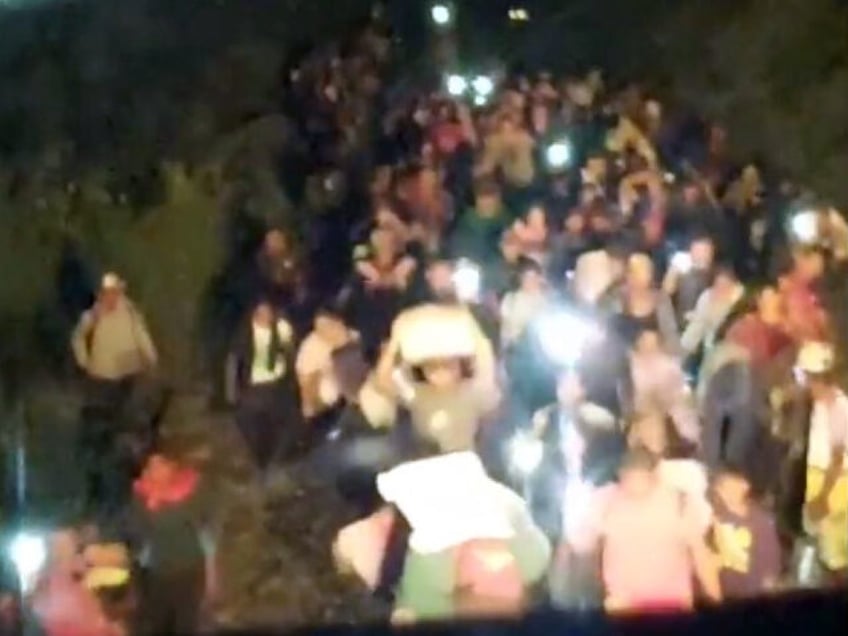 photos migrants swarm mexican railroad force train to stop