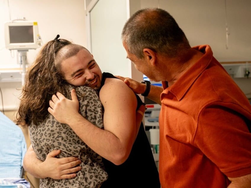 photos rescued israeli hostages reunite with families after daring raid