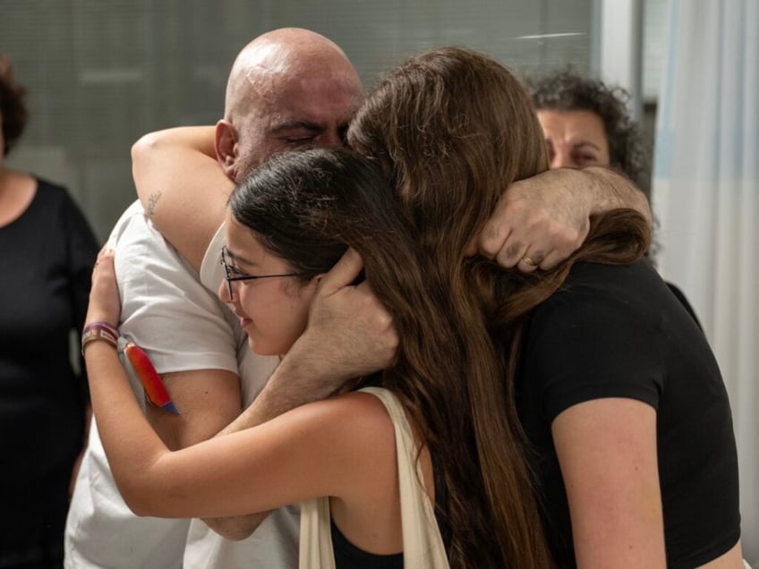 photos rescued israeli hostages reunite with families after daring raid