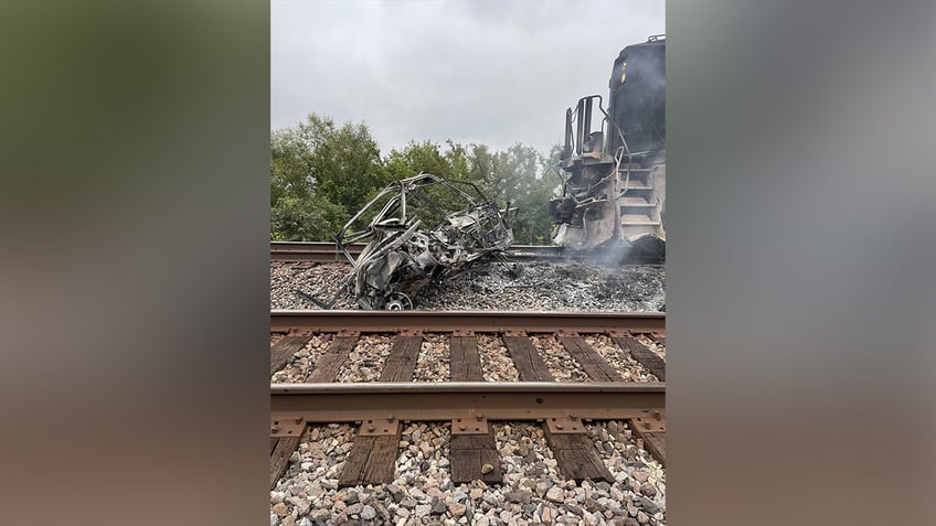 photos show mangled metal mess after freight train crashes into atv