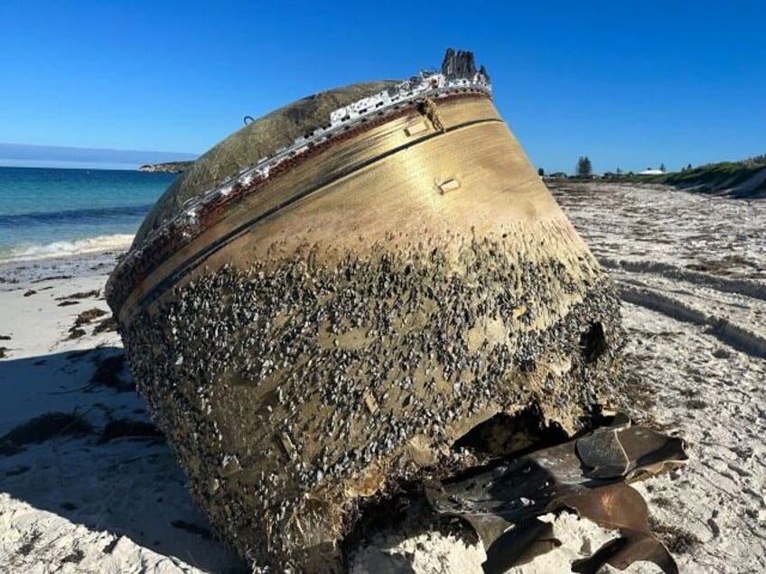 pick up your trash authorities find owner of space junk that washed up on australian beach