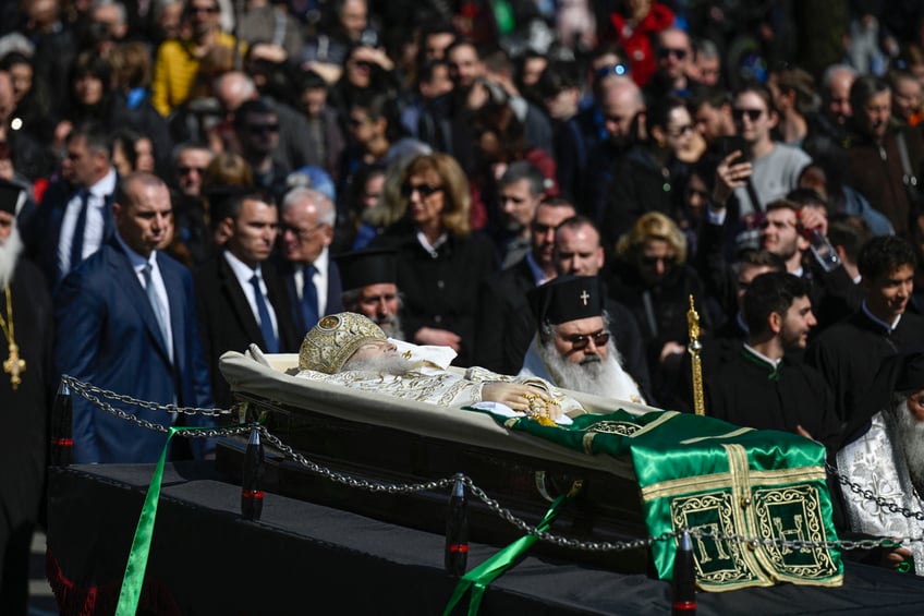 Officials follow the coffin of the late Patriarch Neophyte of Bulgaria's Orthodox Church, during a funeral procession from the golden-domed "Alexander Nevski" cathedral to his burial place in the "St. Nedelya", in Sofia, on March 16, 2024. Bulgaria bid its last farewell to its Christian Orthodox religious leader Patriarch Neophyte, who died on March 13 at the age of 78. (Photo by Nikolay DOYCHINOV / AFP) (Photo by NIKOLAY DOYCHINOV/AFP via Getty Images)