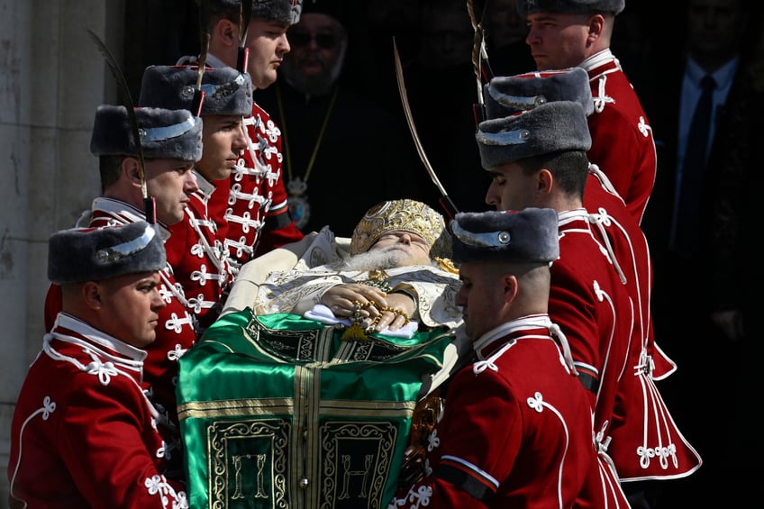 Honor guards carry the coffin of the late Patriarch Neophyte of Bulgaria's Orthodox Church, during a funeral procession from the golden-domed "Alexander Nevski" cathedral to his burial place in the "St. Nedelya", in Sofia, on March 16, 2024. Bulgaria bid its last farewell to its Christian Orthodox religious leader Patriarch Neophyte, who died on March 13 at the age of 78. (Photo by Nikolay DOYCHINOV / AFP) (Photo by NIKOLAY DOYCHINOV/AFP via Getty Images)